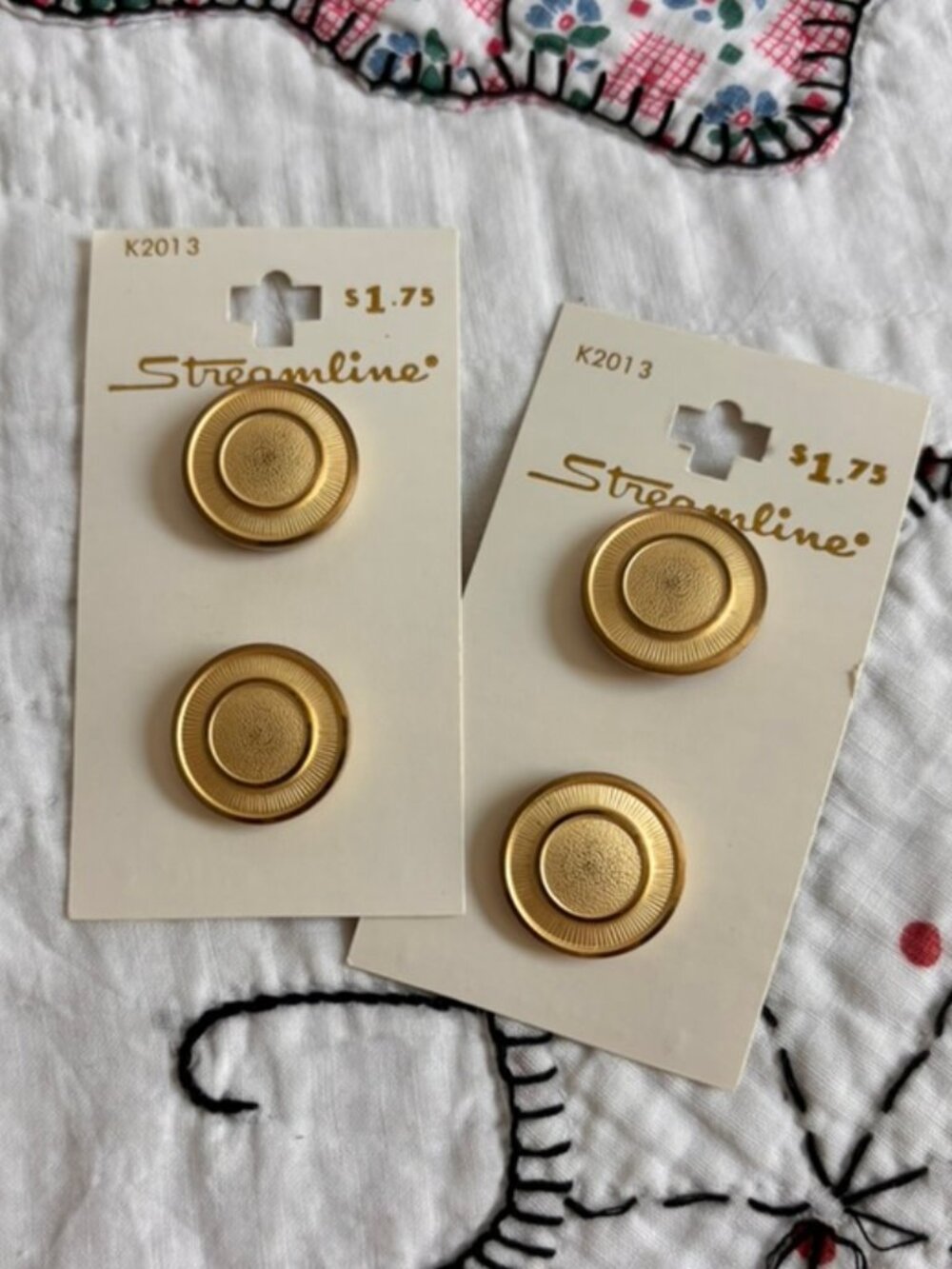 Vintage NOS Streamline brand metal buttons in a brushed gold finish
